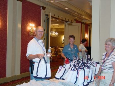 Eric Bishop and Pat Allen getting their Semmes bag and New Orleans Lagniappe 
bag from Pat Davis and Jeanne Gullett.
