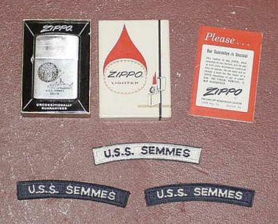 As plank owners we could buy items that were not available to crew members 
that came after us.  I bought the lighter and a pendant.  I still have the 
lighter (well used) but the pendant went away with an ex girlfriend

