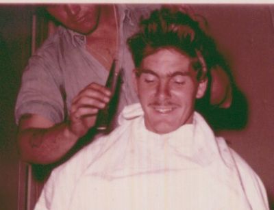 Another haircut shot.   Looks like McCall did something with all that hair 
on top.... maybe he is "styling" it??  
Ha,ha!   I like the way he holds that comb..... like it was a straight razor.   Maybe McCall got out of the Navy and became a hair stylist???  Just 
kidding "Mac". 
Maybe we were letting our hair grow longer because of the Beetles?  
Maybe because we were close to getting out of the Navy?
I got out in Nov. '64.  
Maybe I should stop useing the word Maybe??
