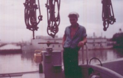 This was taken in Charleston. 
Dated August '64 on back. 
Looks like a repair ship in the background. 
Taken while I was in Wayne Fisher's motor whaleboat. 
I was probably looking for my Macramara Lace that Wayne threw overboard.
I forgive you Wayne! Ha, ha!  

Mitch
