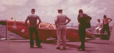 I found some more photos to share with you guys.   You all remember when we shot the drone down I'm sure.   We got hell for it I'm sure, but we were pretty proud of our accuracy!   This was taken in 1964 it says on my photo.  On the left my note says "Troy", then LT Mayfield, then a civilian, and in the t-shirt and whitehat I had "Tarrance?" written, and I believe on the far right, without the shirt, is Charlie Burgroff. 
Mitch
Tarrance (that is me) and it seems like I was on perpetual mess duty.
Marvin Tarrance

