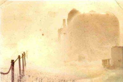 This is the aft gunmount after taking a wave. I think this was around Nov/Dec 1971. 
I thought is was hurricane Agnes in 72 but my memory is worse than my spelling. 
Right after the wave hit, I opened the hatch, stuck my arm out and blindly snapped this shot. 
Jim Moss DK3
