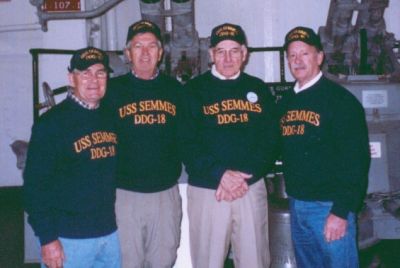 This is a great picture that Donna took with Tom Camann's camera. Looks like 
someone has airbrushed all the wrinkles out! Thank goodness! Left to right 
for those who haven't seen us in the last 40 years are; Bob Mitchell (Mitch),
Tom Camann, Captain Alexander, and Arlen (Alex) Alexander. Photo was taken 
onboard the carrier, USS Yorktown.
