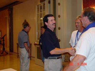 Charlie Layus and Tom Camann greeting Byron Personett from Hermitage, TN at 
Registration, Friday afternoon.
