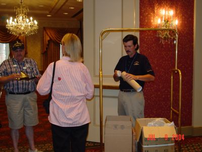 Ron Beinhaur looking at all the goodies brought by Jackie and Byron Personett.
