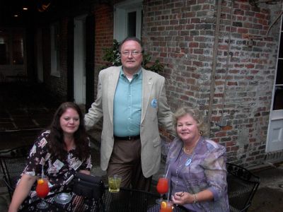 Elaine, Gene Hopper and Sandra Hulsey in the courtyard at Broussard's 
Restaurant.
