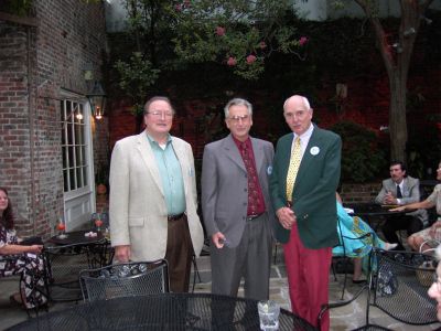 Gene Hopper, Steve Hulsey and Capt. Alexander in the courtyard, Broussard's 
Restaurant.
