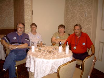Dean and Judi Slone with Mary and Ronnie Ashley enjoying adult beverages at 
the reception.
