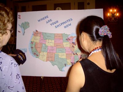 May (Glenn Geick's mother) and Julie Dahl checking out the map that shows 
the location of shipmates who attended the reunion. May came in from Texas 
and Julie from California.
