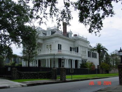 Stately mansion on St. Charles Ave. with wedding cake lace on the exterior.
