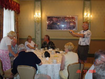 Tom Ringate taking a photo of Hope and Dick Alexander, Angela Defalco and 
Joe Miele, Ron and Bonnie Beinhaur.

