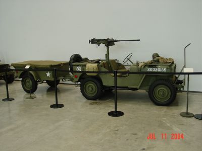 WWII Jeep with 50 caliber machine gun and trailer in D-Day Museum.
