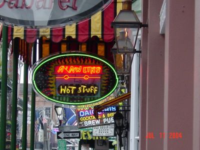 A view of the many signs down Bourbon Street.
