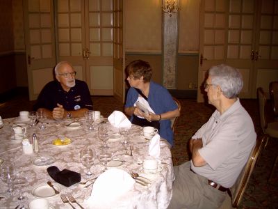 Bob Hill chatting with Lin and Auggie Greidanus at the jazz brunch Sunday AM.
