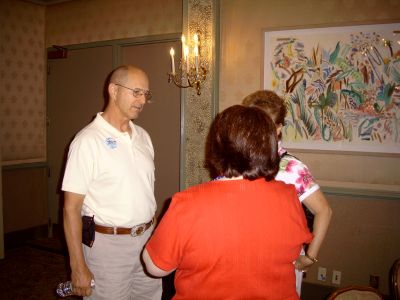 Karen Layus chatting with Eric and Nancy Bishop.
