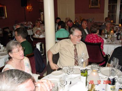 Judy and Dean Slone at the Banquet with Captain Alexander prized wine on 
the table.
