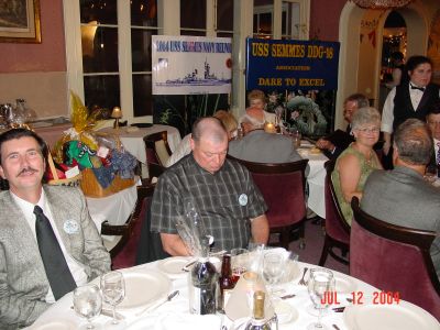 Byron Personett, Terry Meyer, and Pat Davis infront of our USS Semmes banners.
