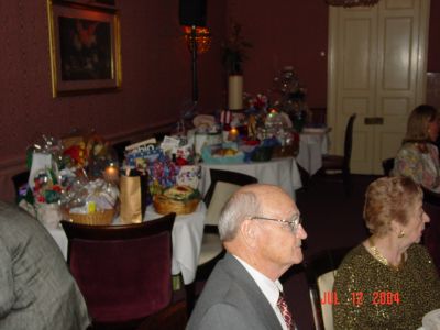 Jim Ferguson and Joyce Nunmaker. Gift table in the background.
