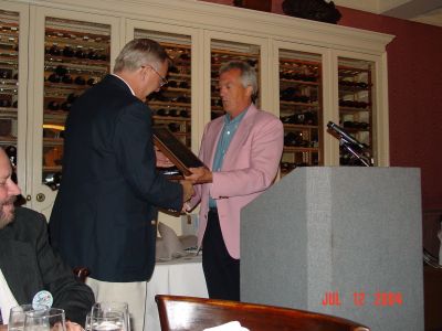 Tom Camann presenting Tom Ringate with a plague for his hard work on the 
USS Semmes Website.
