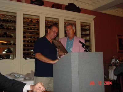 Tom Camann presents Charlie Layus with a plague for his hard work as the 
2004 Reunion Chairman.
