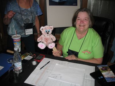 Karen registering "Traveling Teddy" so he would no longer be a stowaway.
