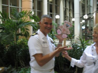LCDR Vince Stanley, Traveling Teddy, and Valerie Ringate
